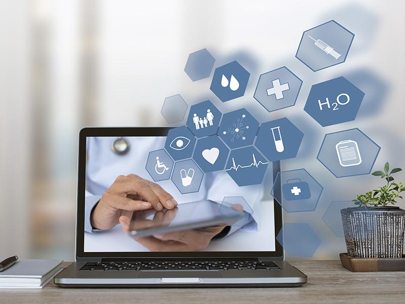 ordinateur avec pictogrammes de santé